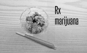 Medical marijuana cigarette and buds in a prescription container; image by Circe Denyer, via publicdomainpictures.net, CC0.