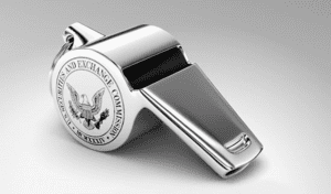 A silver whistle with &ldquo;Securities and Exchange Commission&rdquo; printed on one side; image via U.S. SEC Office of the Whistleblower, public domain.