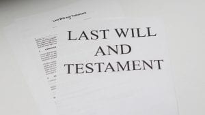 White paper with &ldquo;Last Will & Testament&rdquo; printed on it; image by Melinda Gimpel, via Unsplash.com.