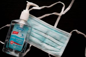 Hand sanitizer and a face mask