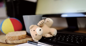 Laptop with children&rsquo;s toys; image by Congerdesign, via pixabay.com.