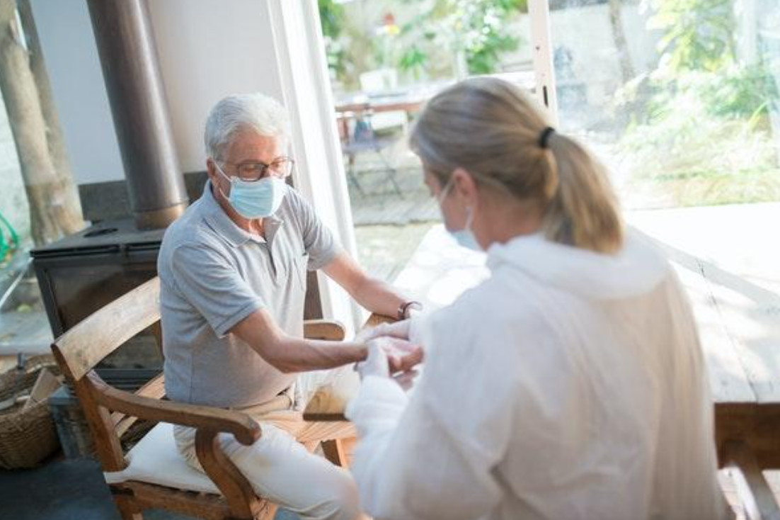 Older man and healthcare worker; Photo by Kampus Production on Pexels.com.