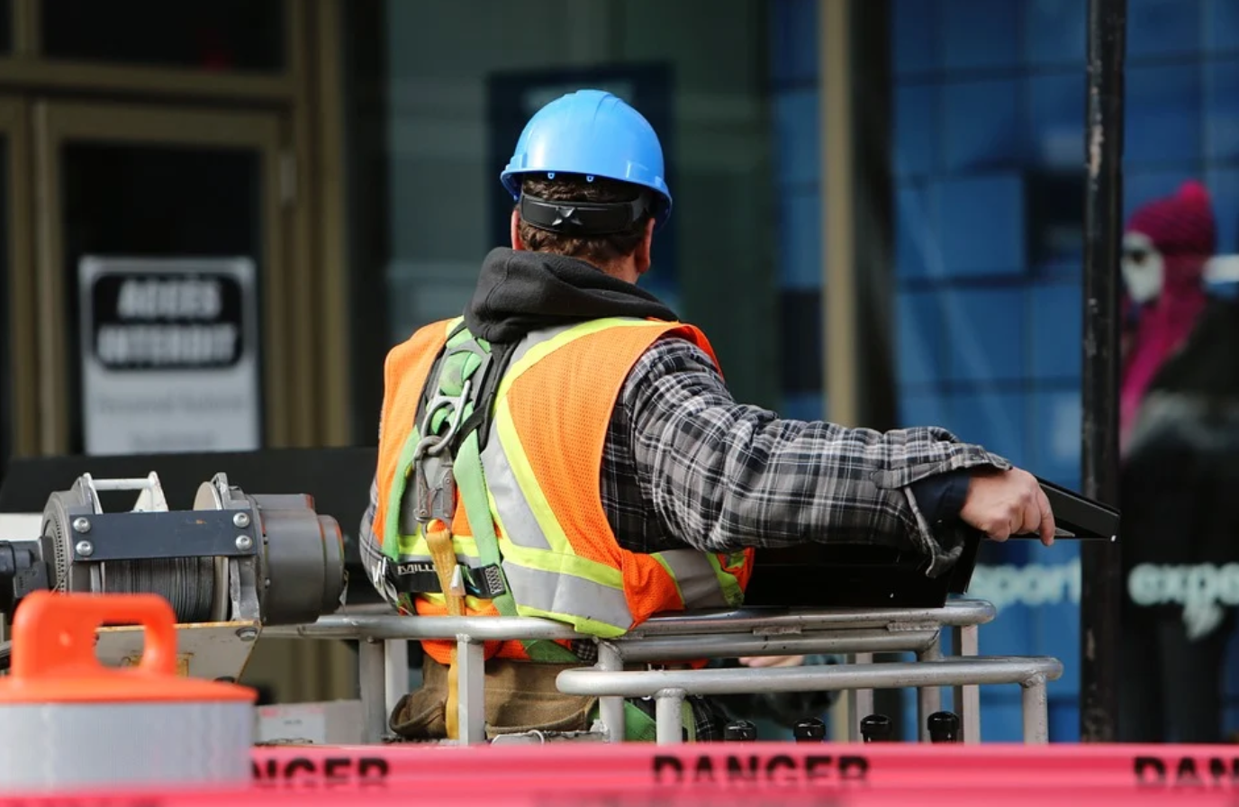 Man in safety gear operating equipment; image by Life-Of-Pix, via Pixabay.com.
