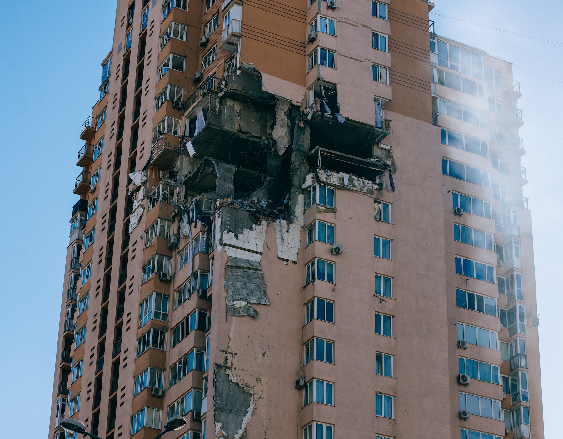 Damaged buliding, Kyiv, Ukraine; image by Julia Rekamie, via Unsplash.com.