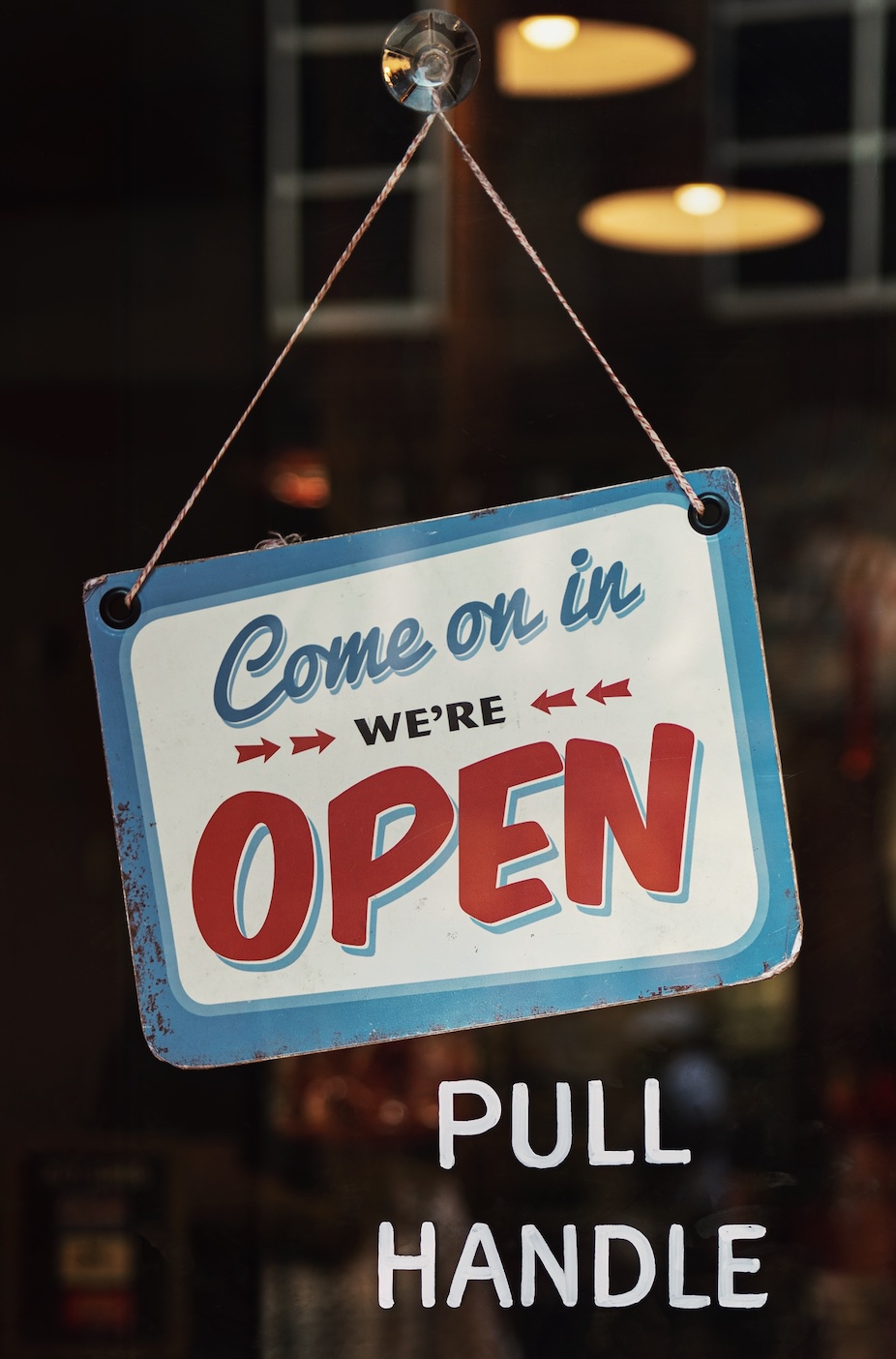 Red, white, and blue Come on in, we're open sign; image by Tim Mossholder, via Pexels.com